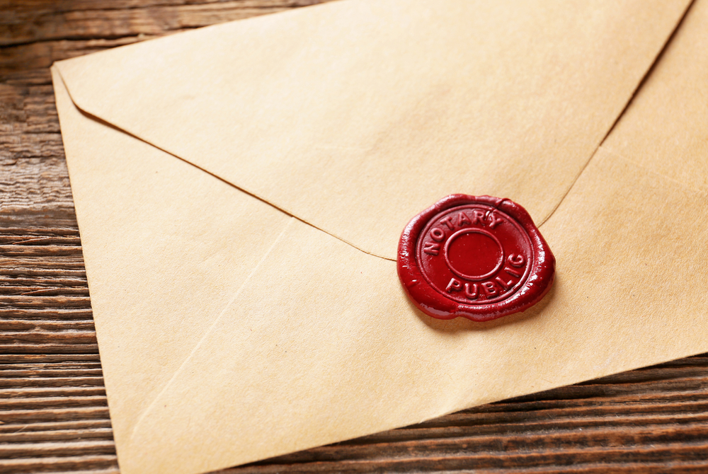 Envelope,With,Notary,Public,Wax,Seal,On,Table,,Closeup